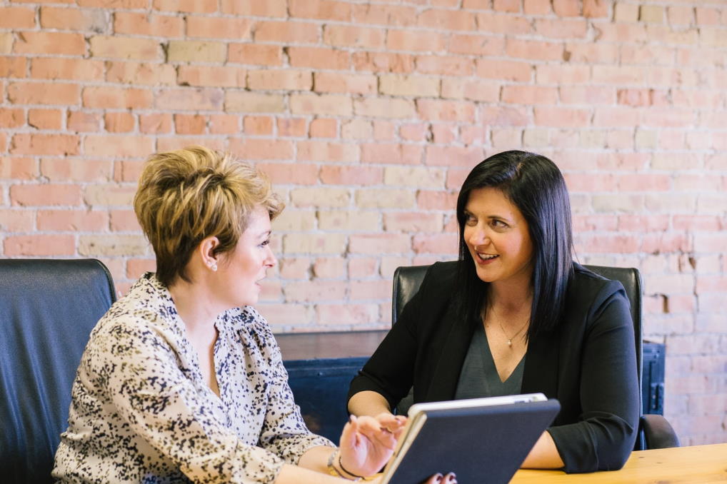 Image of two ladies in a meeting